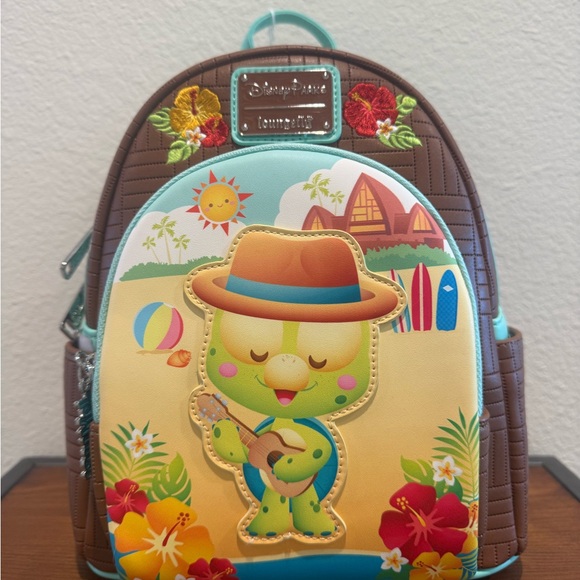 Loungefly Handbags - NWT Disney Parks Olu Mel Aulani Resort Loungefly Backpack